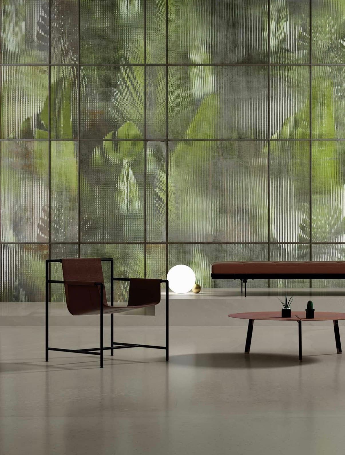 Edrak lounge with leather seating against a fluted glass wall