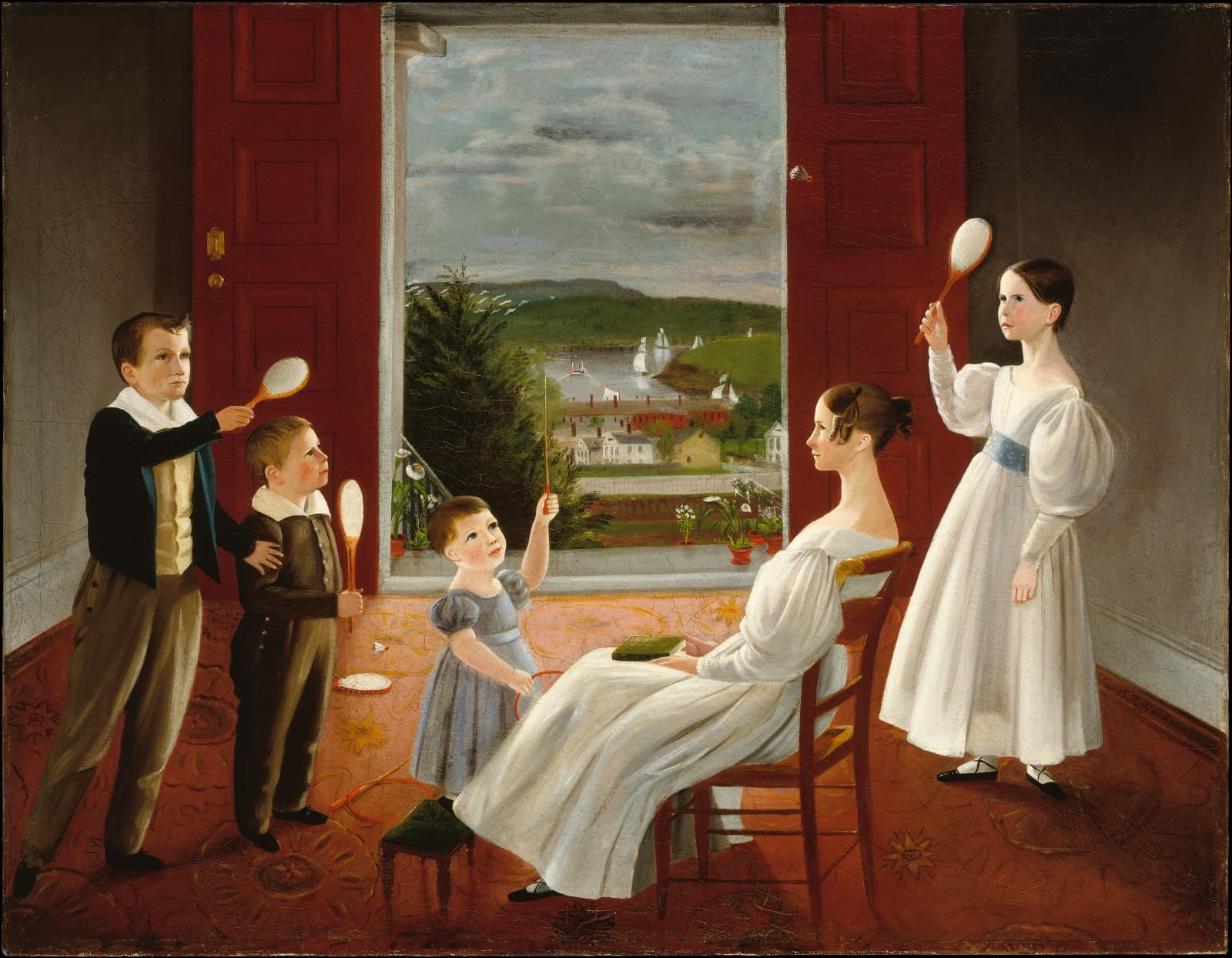 Five children in a red-walled parlour playing battledore and shuttlecock beside an open window onto a harbour